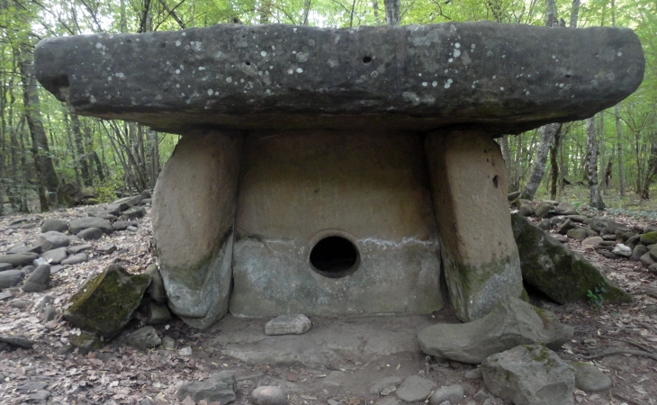 Similar megalithic stone with hole found on Earth: Dolmen, Pshada village, Russia