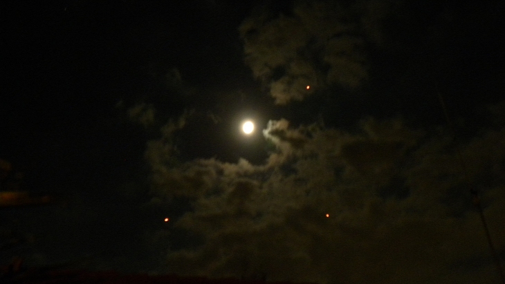 The bright orange/red orbs with the clouds and full moon in the background (click for larger image)
