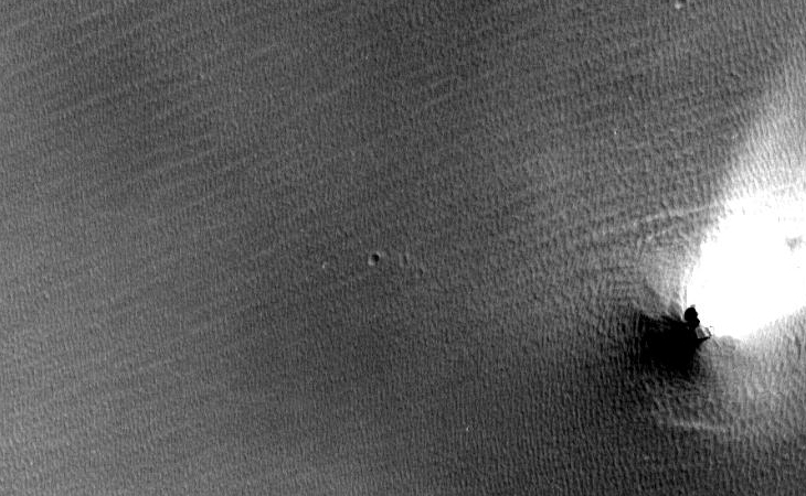 Object emitting beam of very bright light onto the Martian surface