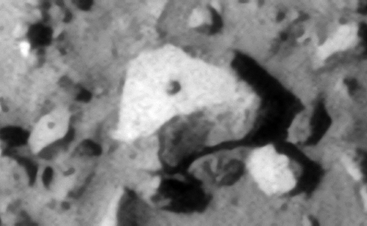 Charitum Montes on Mars: Large triangular object with small feature in its center - Click for original image at 1:1 scale