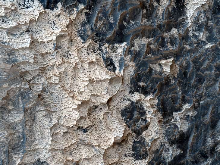 Low-resolution colour photograph showing the weird geology in this region of Mars (click for larger image)