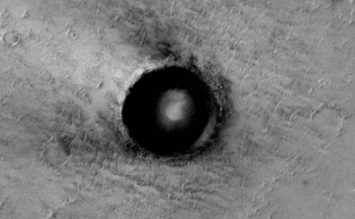 Self-illuminating sphere in Martian crater
