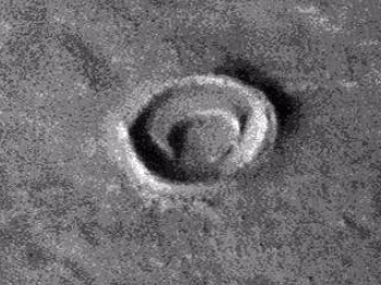 Crescent shaped object inside crater on Mars