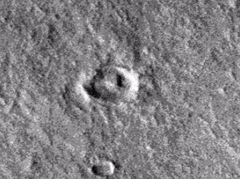 Small triangular object inside cater on Mars
