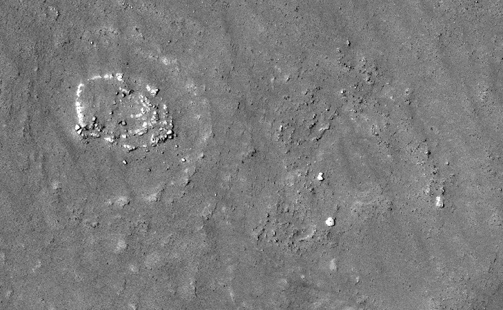 A zoomed-out view of a circular megalithic structure consisting of concentric rings similar to other structures found in Kotka crater