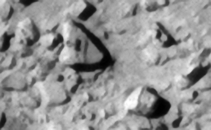 Note the strange Egyptian Ankh-like symbol on the triangular block located to the top left. The square cube-like block to the bottom right has what appears to be a larger base on the side. A perfect spherical feature is seen on the object located to the middle left