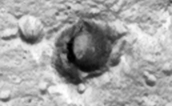 Hangar/Underground Entrance or Crater? The lower rim of the crater appears to be dug out