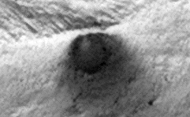 Underground Entrance, Cave, Air-Vent? It appears as if something is being vented which is leaving a dark-coloured stain on the Martian surface