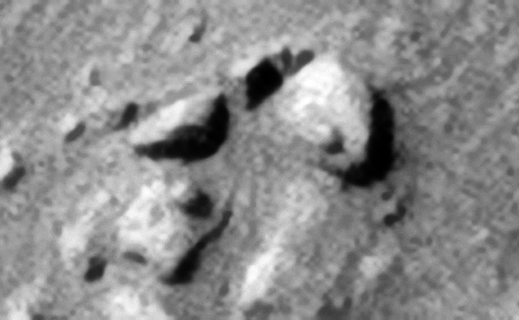Two eroded blocks with spherical-shaped features or knobs. Note the rectangular block located middle top