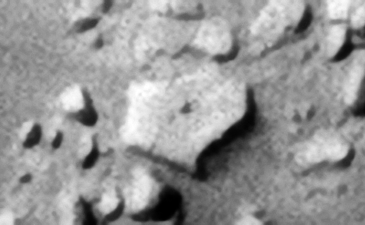 Another hexagonal-shaped object, could this be a metal plate or megalithic slab? There is also a small dome-shaped feature in the center