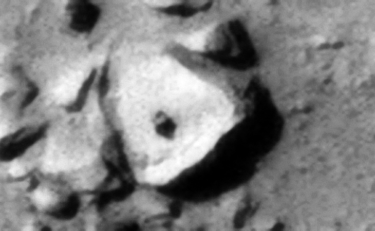 Green Crater on Mars: Large triangular object with small feature in its center - Click for original image at 1:1 scale