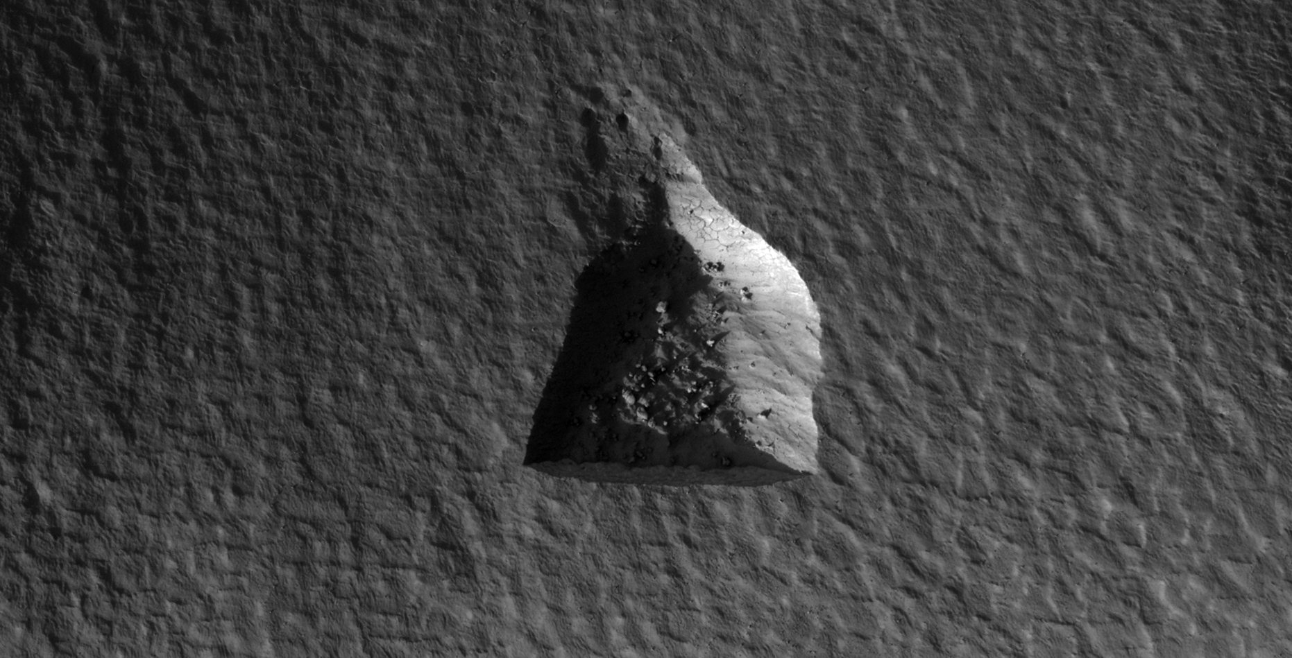 Mine or triangular-shaped hole carved into the Martian surface. The two straight sides measure approximately 210 metres in length