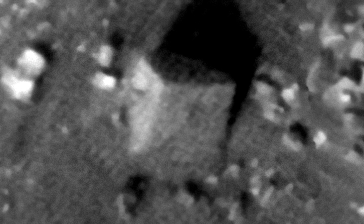 Partially buried, large megalithic-block on Mars (approximately 8 metres wide)