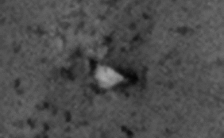Wedge-shaped craft embedded in Martian surface?