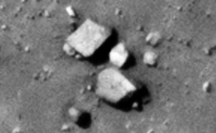 Two megalithic blocks and a small cube-shaped piece with possibly small dome on top